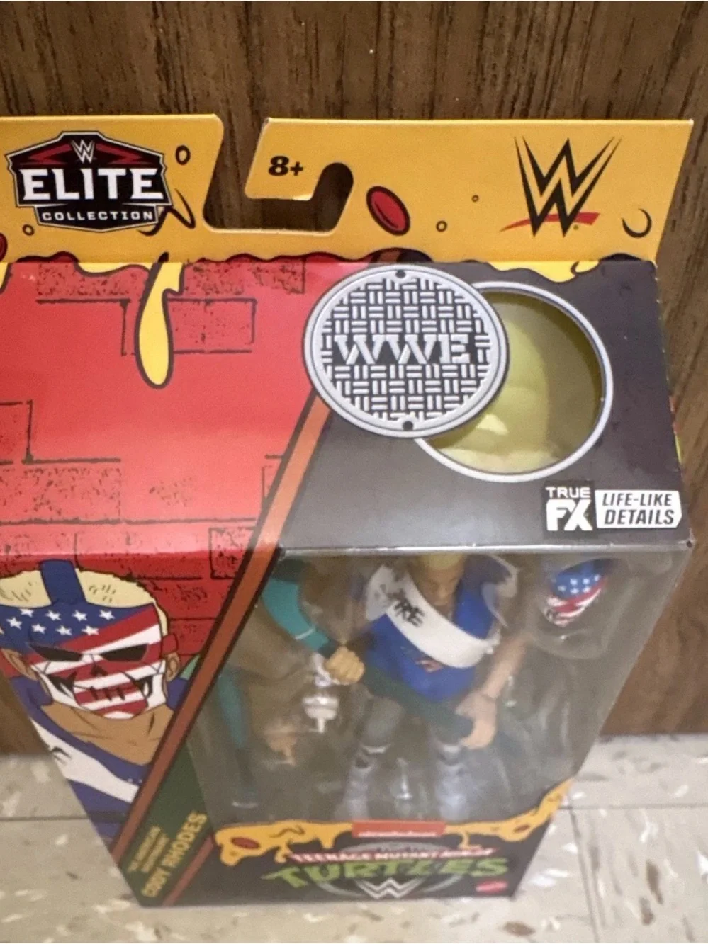 WWE Cody Rhodes Action Figure in Blue and Gray with Teal Accessory